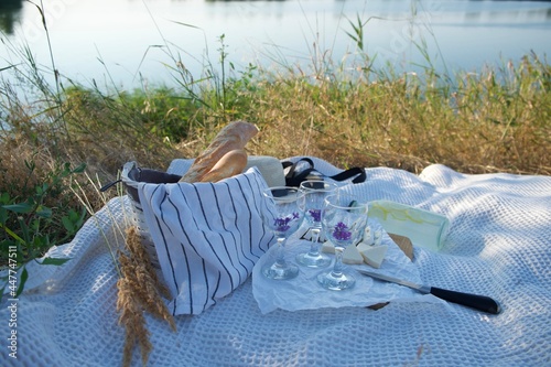 picnic with cheb and cheese by the water photo