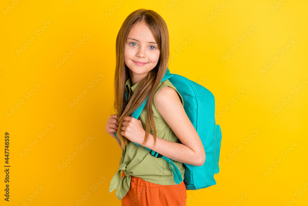 Photo portrait schoolgirl wearing green shirt going to school with backpack isolated bright yellow color background Photo portrait schoolgirl wearing green shirt going to school with backpack isolated bright yellow color background