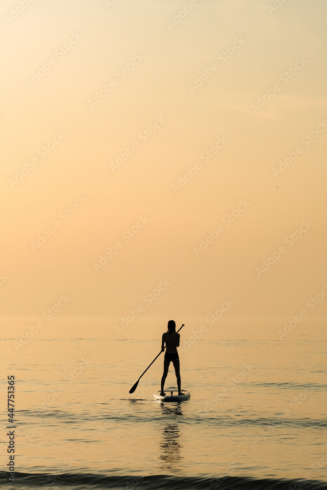 A female paddleboarder, Cornwall, UK.