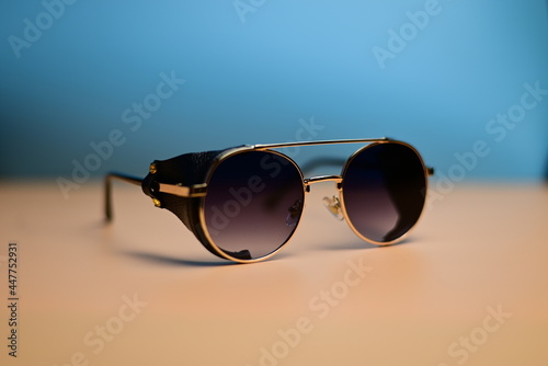 steampunk sunglasses with leather inserts on a dark background