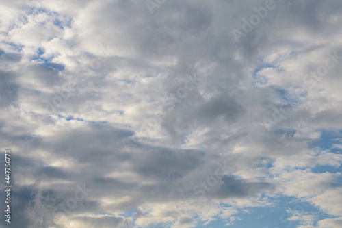 Fototapeta Naklejka Na Ścianę i Meble -  Abstract background of white fluffy clouds on a bright blue sky