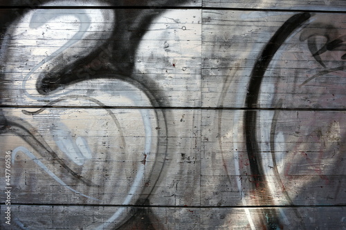 Ausschnitt eines Graffiti an einer Holzwand aus Brettern im Nordend von Frankfurt am Main in Hessen photo