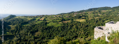 Panoramic hilly landscape of Lower Srebrenik settlement with forests and meadows and old Srebrenik castle