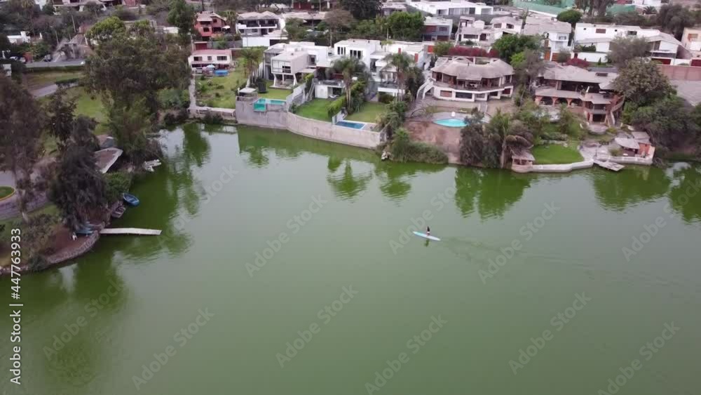 Aerial shot. Surfer paddling in a lagoon of La Molina in Lima - Peru