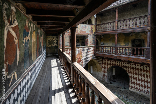 Inner courtyard of Fenis Castle with medieval frescoes decorating the walls, Aosta Valley, Italy
