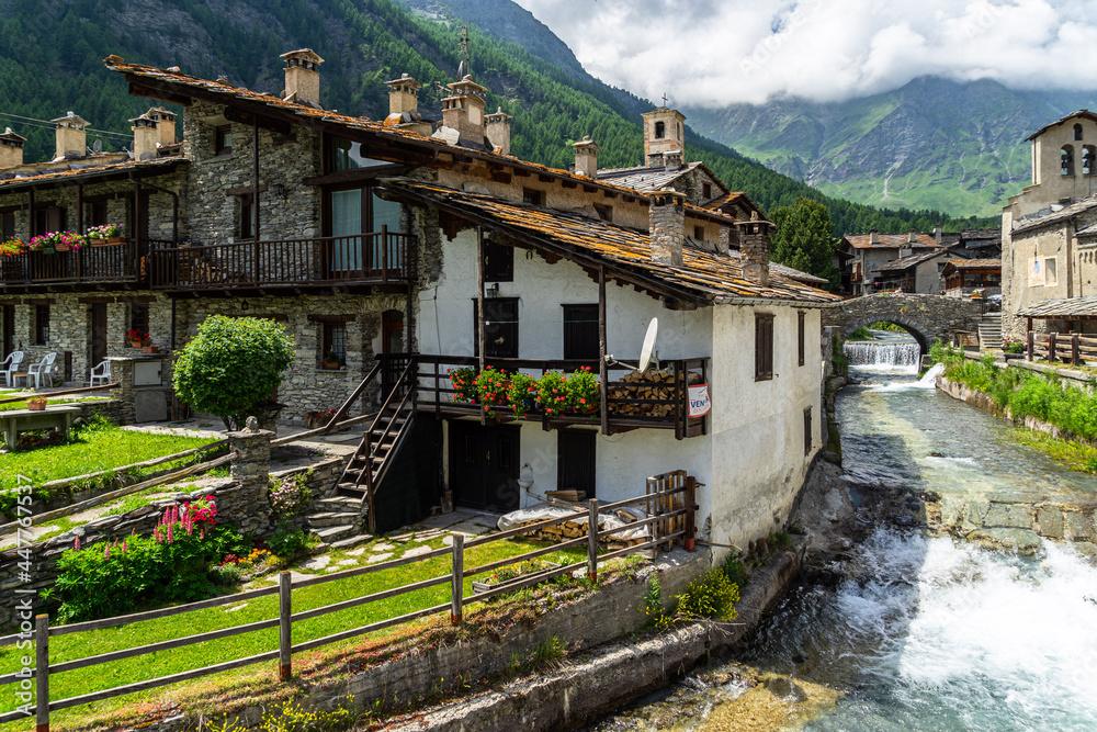 View of Chianale, a typical alpine village in Piedmont region and one of the most beautiful villages in Italy View of Chianale, a typical alpine village in Piedmont region and one of the most beautiful villages in Italy