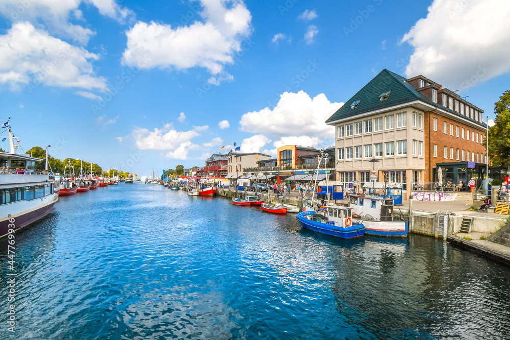 Shops and cafes line the Alter Strom canal at the cruise port in the resort town of Warnemunde, near Rostock on the northern coast of Germany.