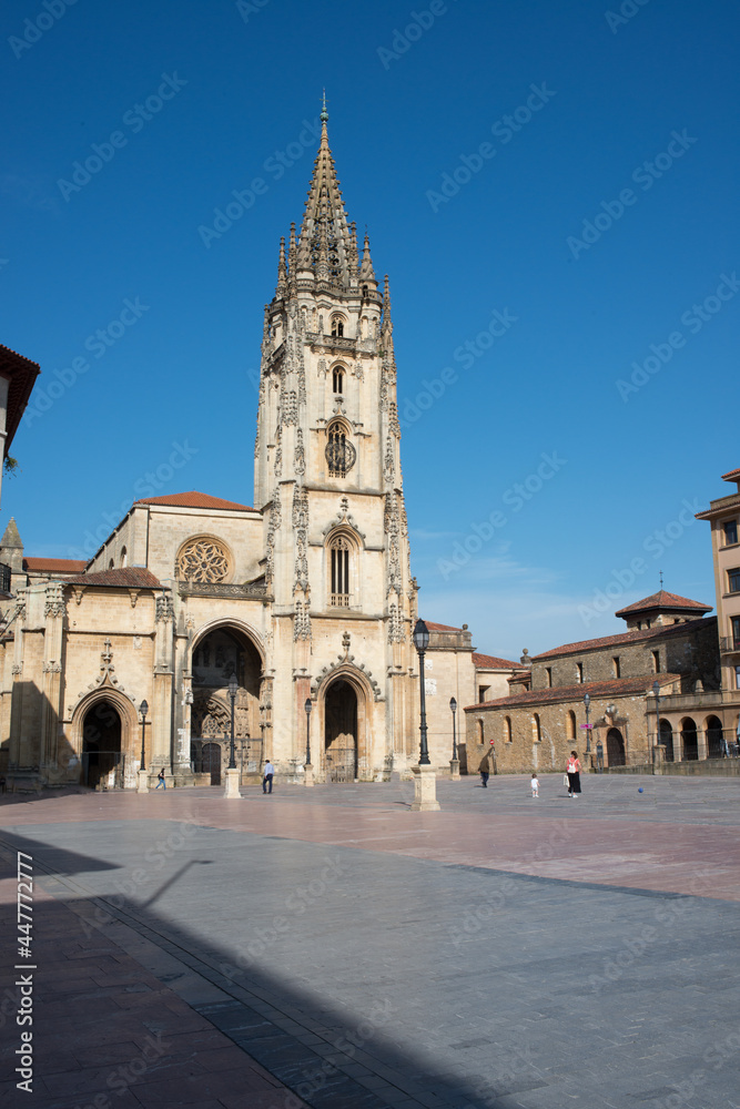 Beautiful view of gothic Cathedral at Oviedo, Asturias. Some unrecognizable people at the square in front of the church. Spain, Europe