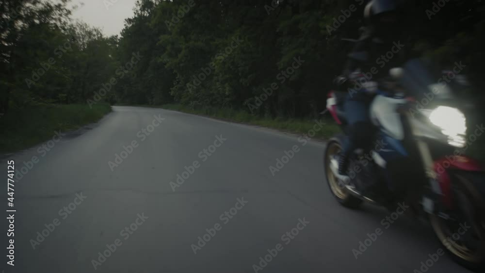 Active sexy girl riding his motorcycle in a country road Active sexy girl riding his motorcycle in a country road