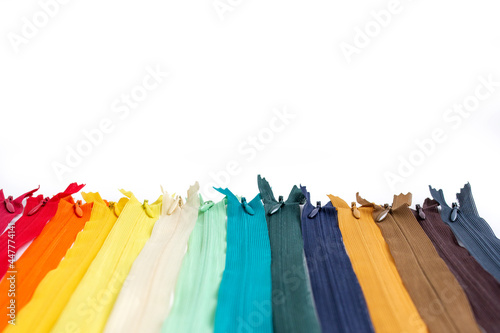 multicolored hidden zippers for clothes on a white background