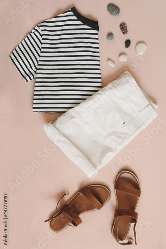 summer flat lay of fashion women outfit on beige background top view, vacation on sea concept
