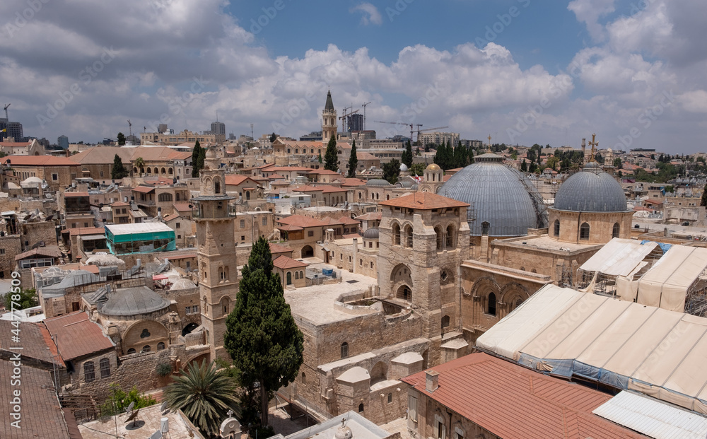 Eye-bird panoramic view on Jerusalem Old City. Two gray domes of Church of the Holy Sepulcher on the foreground. Church of the Holy Sepulcher under reconstruction.