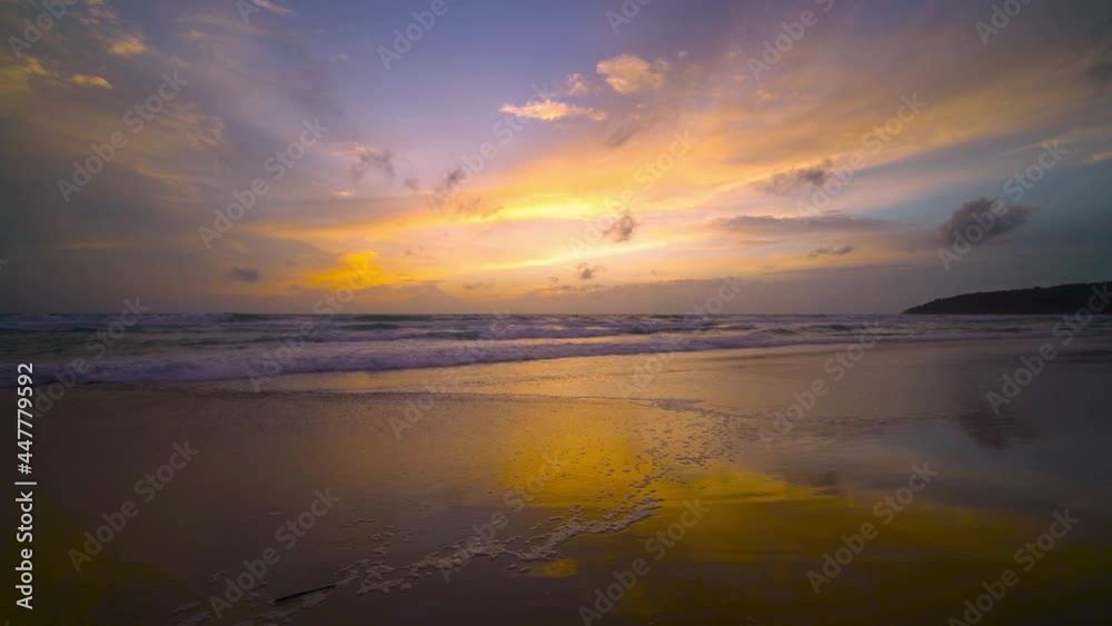 The scenery, beaches, natural beauty and wonders. sunset in the sea On a beautiful day, the sky is golden yellow and the sea waves wash on the beautiful soft sandy beach The scenery, beaches, natural beauty and wonders. sunset in the sea On a beautiful day, the sky is golden yellow and the sea waves wash on the beautiful soft sandy beach