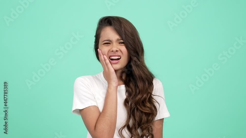 upset teen girl suffer from pain of toothache, dentistry photo