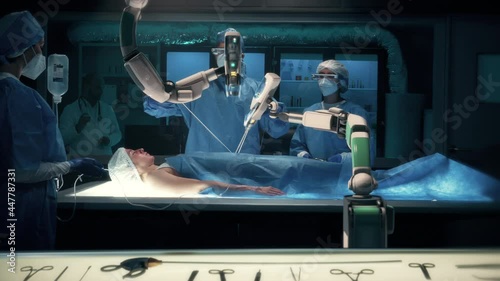 Team of surgeons wearing special augmented reality glasses perform a delicate operation using medical surgical robot arms. Modern medical equipment. Robotic arm for minimal invasive surgery.