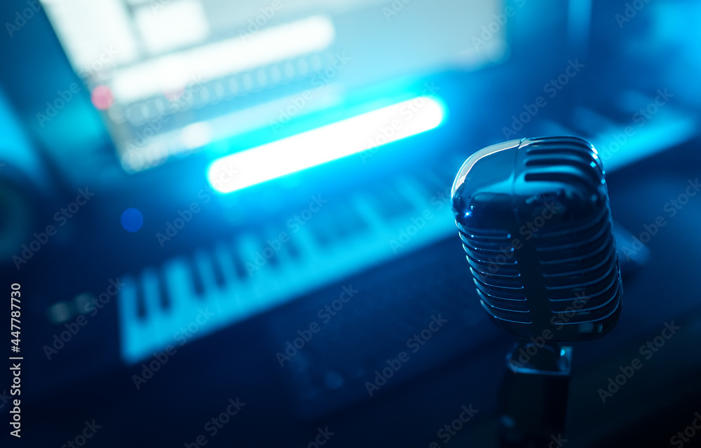 Retro microphone and midi keyboard synthesizer in record studio. Retro microphone and midi keyboard synthesizer in record studio.
