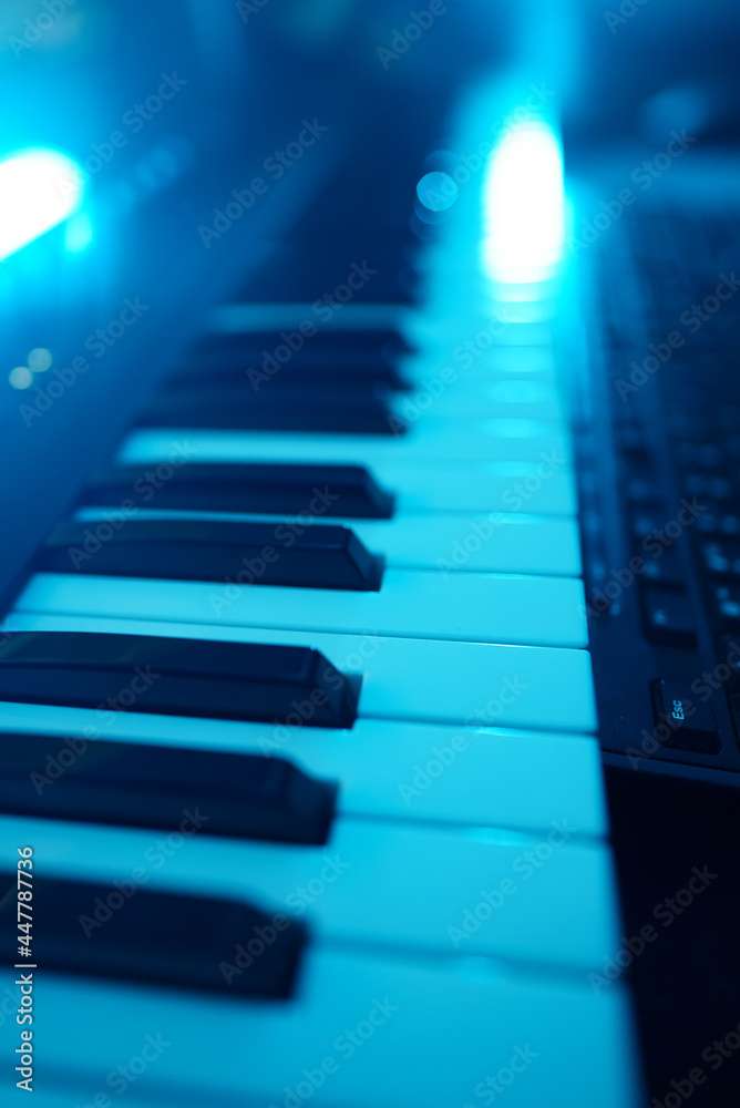 Professional midi keyboard synthesizer in record studio.