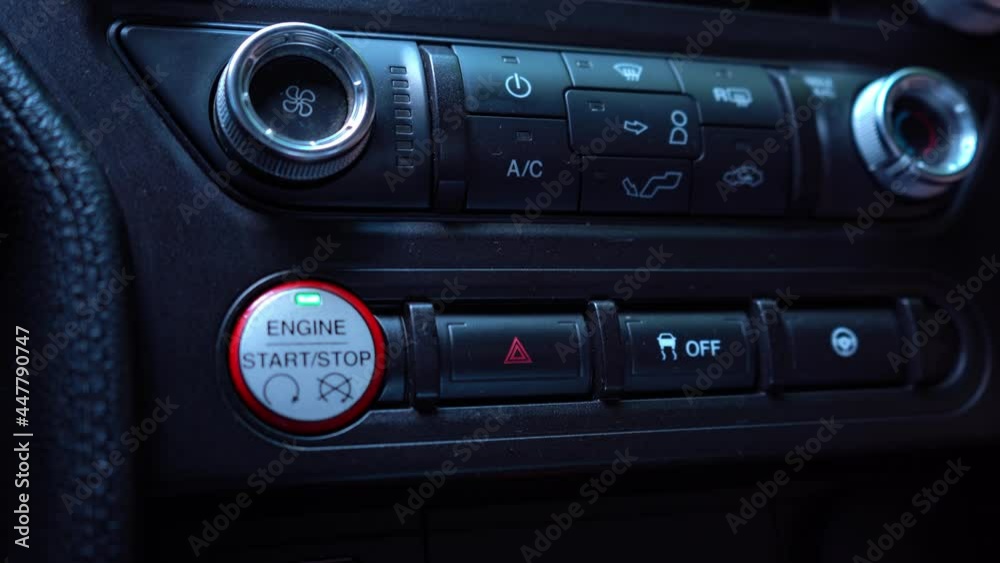 Emergency Car Warning Lights After Breakdown Accident. A mans hand presses the emergency button