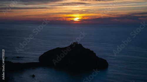 Timelapse sunset of San Juan de Gaztelugatxe in Basque Country, Spain. Very famous and touristic Spanish island surrounded by the sea. 4k video. Spain tourism in summer. Travel destination.