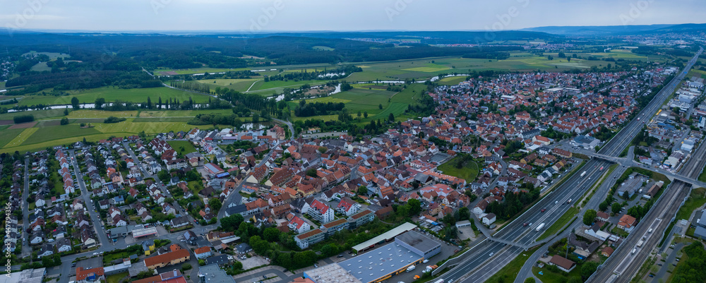 Aerial view of the city Baiersdorf in Germany, on a cloudy morning in spring.