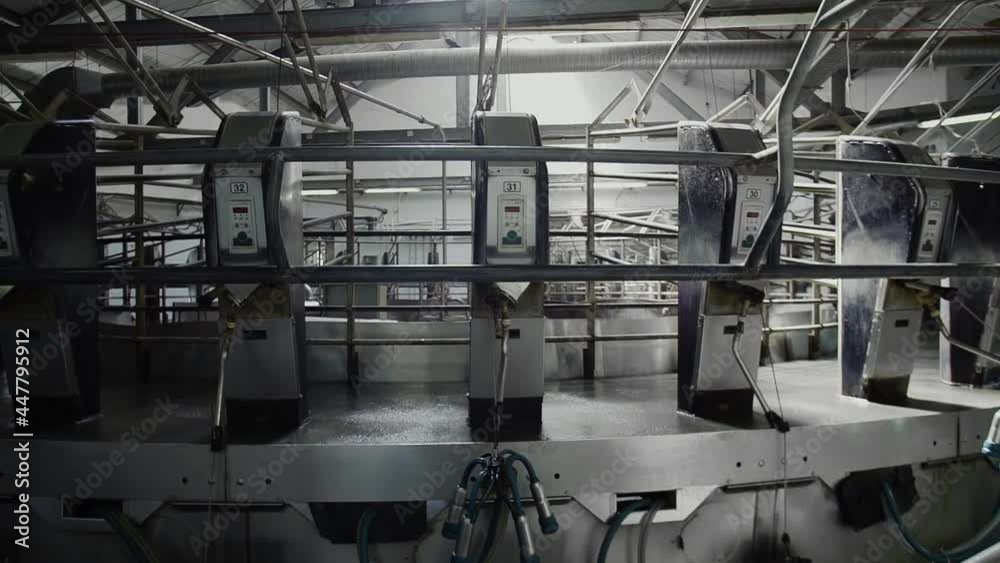 Empty rotary milking parlor in a large dairy farm Empty rotary milking parlor in a large dairy farm