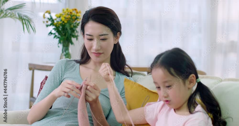Happy mother and daughter knitting at home,4K Happy mother and daughter knitting at home,4K