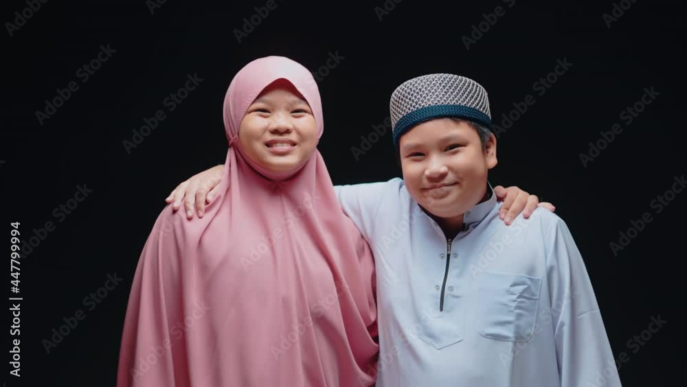 Concept Eid mubarak, Muslim girls and boys are Muslim, hug and greet in love at the mosque after prayer.
