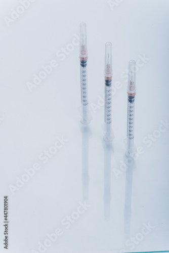 Medicine  Injection  vaccine and disposable syringe isolated  drug concept. Sterile vial medical. Medical Syringe needle. Macro close up on backgrounds gray.