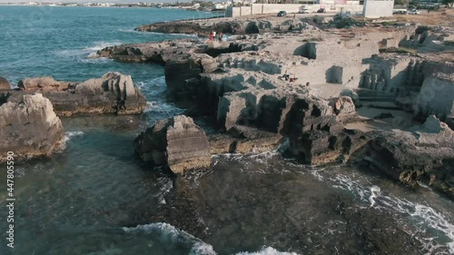 Aerial View Of Calette di Torre Cintola, Unique Beach With Ruins Of A Watchtower In Capitolo, Puglia, Italy.  photo