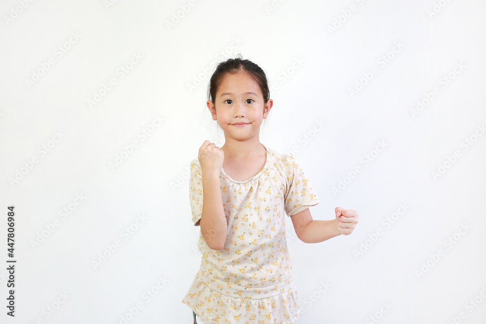 Smiling Asian little girl child showing expression hand holding something without theme isolated on white background Smiling Asian little girl child showing expression hand holding something without theme isolated on white background