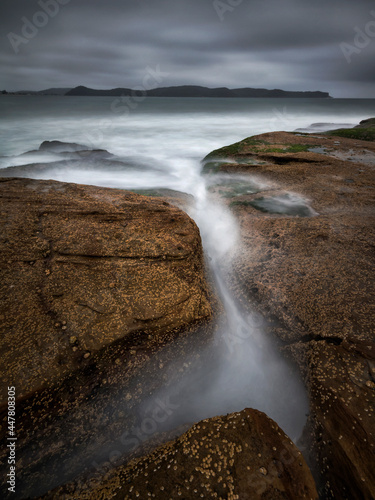 water flowing into a body of water