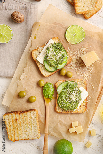 Tasty toasts with pesto sau...
