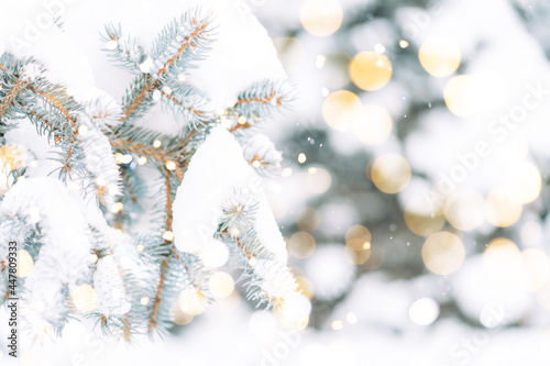 Christmas tree background outdoor with snow, lights bokeh around, and snow falling, Christmas atmosphere