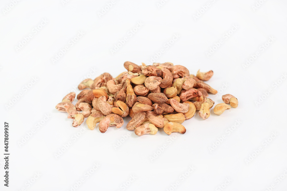 Pile of Cashew nuts with shell isolated on white background Pile of Cashew nuts with shell isolated on white background