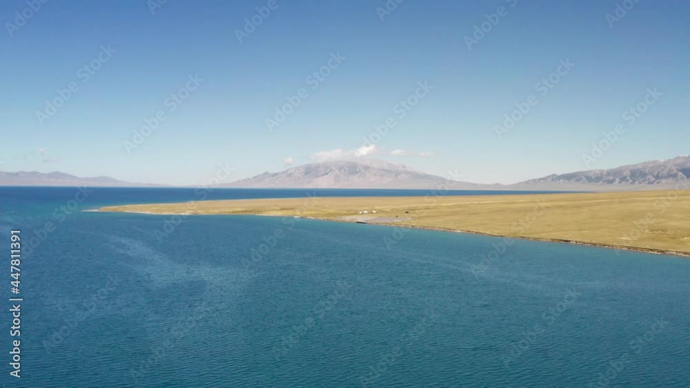 Lake and grassland with a sunny day.