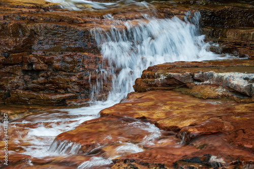 Water flowing over brown rocks