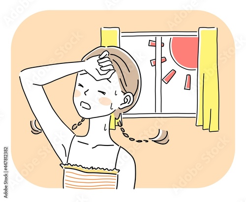 暑い部屋にいる女性