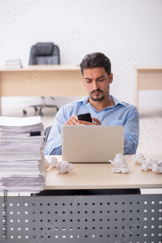 Young male employee rejecting new ideas in the office