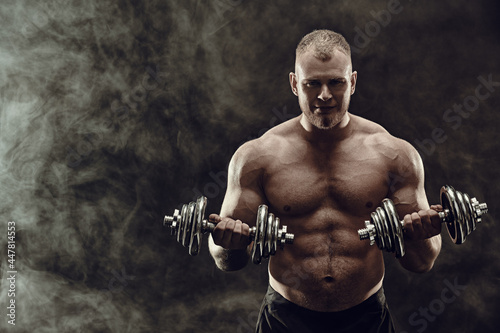 bodybuilder with dumbbells © Andrey Kiselev