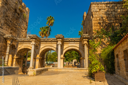 ANTALYA, TURKEY: Adrian Gate in the background blue sky. Antique ancient construction of marble and limestone.
