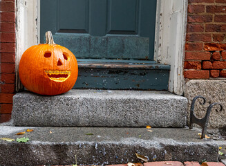 smiling pumpkin with braces. funny Halloween pumpkin on the doorstep. Orthodontic or dentist office. copy space for your text
