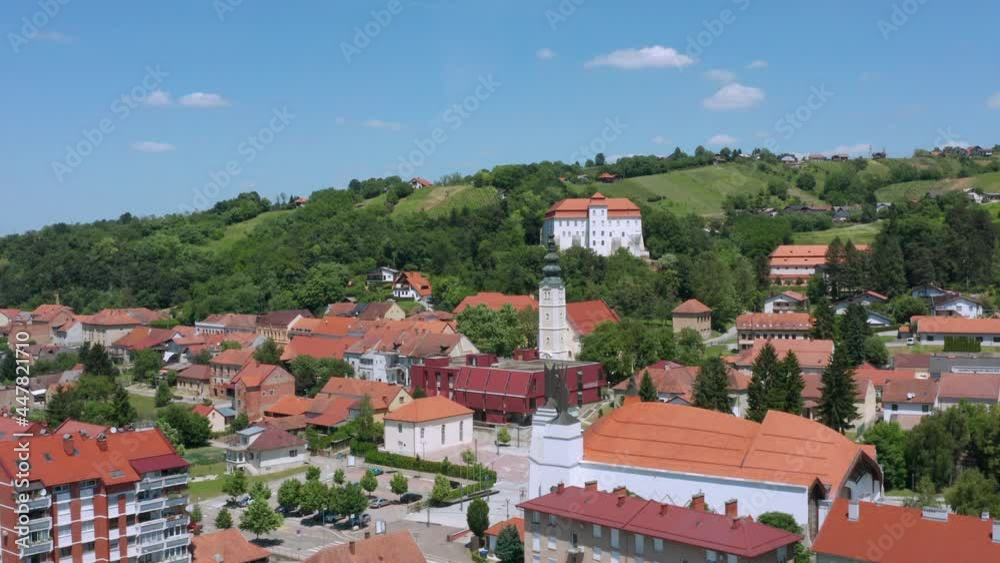 Clock Tower Of The Lendava Castle Within The Townscape Of Lendava In Prekmurje Region, Slovenia. aerial Clock Tower Of The Lendava Castle Within The Townscape Of Lendava In Prekmurje Region, Slovenia. aerial