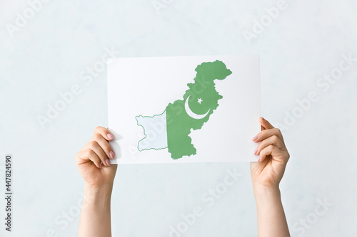 Female hands holding paper ...