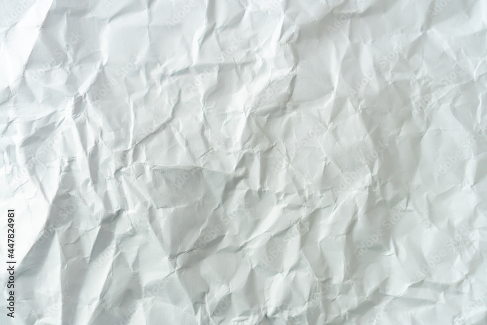 Top view of white crumpled paper texture. Top view of white crumpled paper texture.