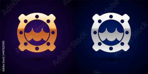 Gold and silver Ship porthole with rivets and seascape outside icon isolated on black background. Vector