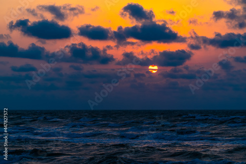 Colorful dramatic sunset on the coast