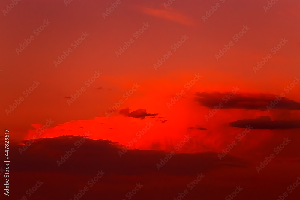 Red orange epic dramatic scary mystical sunset sky with clouds, bright colorful sky landscape background