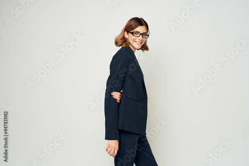 Business woman in black suit posing fashion work professional