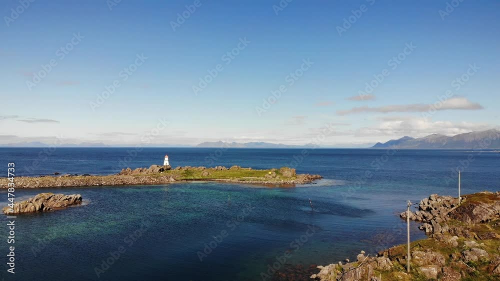 Lighthouse at Hovsund fishing port, Gimsoya Lofoten Islands in Norway Lighthouse at Hovsund fishing port, Gimsoya Lofoten Islands in Norway