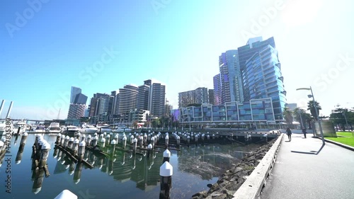 Coastline skyscrapers in Melbourne city Docklands, dolly forward view